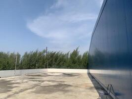 Rooftop View of Building with Blue Wall photo