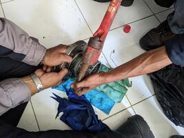 Two Men Working for remove joint connection pipe with pipe wrench. Two Men Working for remove joint connection pipe with pipe wrench. photo