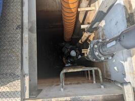 Two Workers Inspecting a Pipe Inside a Concrete Structure Confine space photo