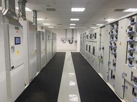 Electrical Panels in a Room with a Black Mat Power Plant photo