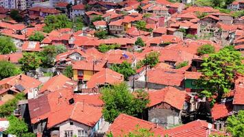 A stunning aerial view showcasing the terracotta rooftops of Ankara, Turkey. The houses are clustered together, creating a beautiful and intricate pattern video