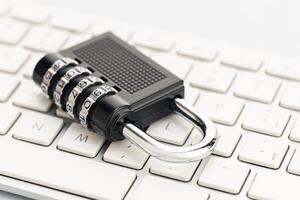 Closed padlock on computer keyboard. Cyber security concept photo