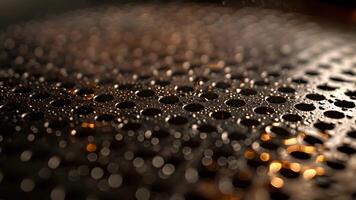 Up close we see the intricate pattern of tiny perforations that cover the entire surface of an electric wok. These small holes allow for even heat distribution and create the signatur video