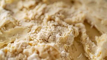 de texturerad yta av en deg krok täckt i bitar av klibbig deg en testamente till de hård arbete den sätter i till skapa de perfekt deg varje tid video