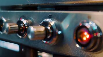 A detailed shot of a water boilers control panel featuring buttons to adjust temperature and an indicator light for when the water is boiling video