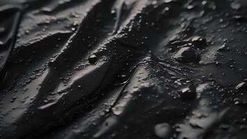 An upclose look at the hightech fabric used to construct a waterproof and windproof hiking jacket with a soft velvety texture and a glossy sheen video