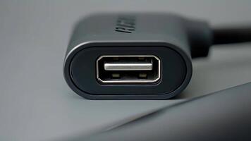 A tightly focused image of a power banks micro USB port where a charging cable is securely plugged in video