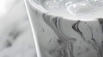 A unique cocktail shaker crafted from marble with intricate white s running through the smooth polished surface for a sophisticated and luxurious feel video
