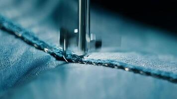 A closeup of a needle piercing through layers of fabric creating a strong and sy seam.. video