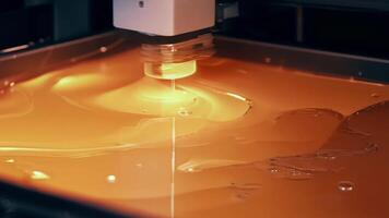 Extreme closeup of a resin vat in a SLA stereolithography printer showing the precise layering and curing process used in this type of additive manufacturing.. video
