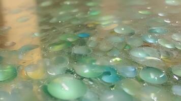 The smooth surface of a recycled glass countertop made from melted down glass bottles and jars.. video