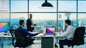 A bustling tech startup office with young professionals collaborating on projects, sleek computers, and large monitors displaying data and graphs. The atmosphere is vibrant and dynamic. video
