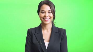 Asian woman in black suit smiling and looking at camera The picture has a bright and cheerful mood. and women's smiles It indicates that she is happy and confident. video
