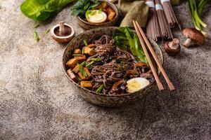 Soba noodle with tofu and mushroom photo