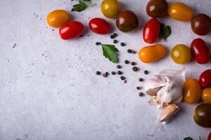 Assortment of different cherry tomatoes photo