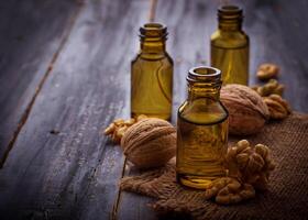 Walnuts oil in small bottles photo