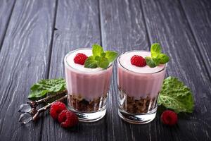 Dessert with granola, yogurt and raspberry photo
