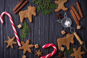 Christmas background with cookies, tree and cinnamon photo