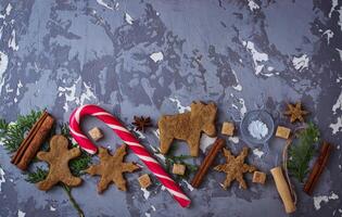 Christmas background with cookies, tree and cinnamon photo