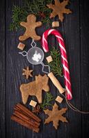 Christmas background with cookies, tree and cinnamon photo