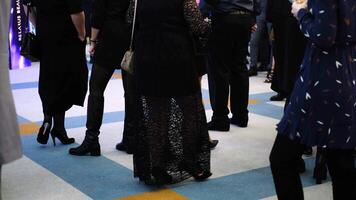 People in evening dresses communicate and wait for the start of the event. video