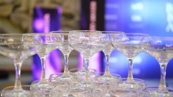 Empty champagne glasses tower design for drink in wedding party event or beverage design for reception celebration. Close up video