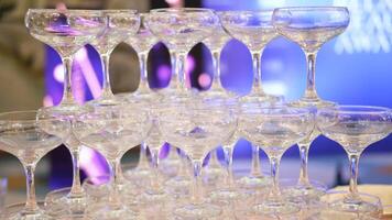 Empty champagne glasses tower design for drink in wedding party event or beverage design for reception celebration. Close up video