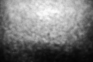 Bokeh lights on black background, shot of flying drops of water in the air, defocused water drops levitation on dark, blurred photo