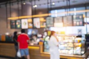 blurred coffee shop and people sit on table blur background with bokeh image photo
