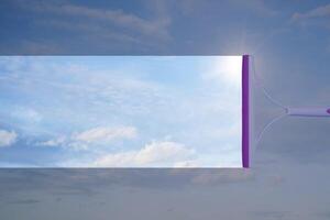 cleaning window with squeegee and wiper on a sunny day with a bright blue sky. photo