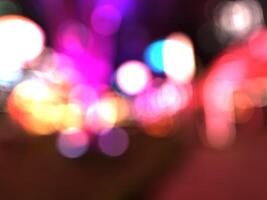 Bokeh, Defocused image of illuminated lights at night. A blurry picture of a purple and yellow light from a blurry background. Abstract background. photo