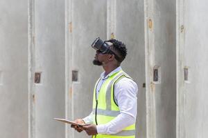 Engineer man with virtual reality glasses at construction site, Construction workers at work photo