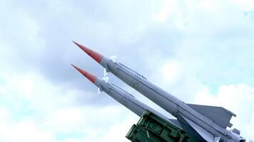 Pair of Military Missiles Pointing Skyward photo