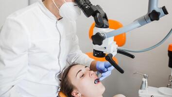 Dentist Using Advanced Microscope for Oral Checkup photo