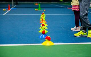 Children's Tennis Training with Balls and Cones. Minsk, Belarus - October 18, 2021 photo