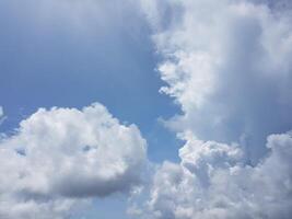 Dreamy Close-Up of Fluffy Clouds. beautiful sky. This enchanting photograph captures a stunning close-up of fluffy clouds against a clear sky photo