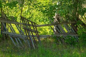 wooden fence with a broken section photo