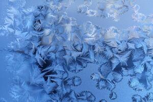 Ice pattern on window glass photo