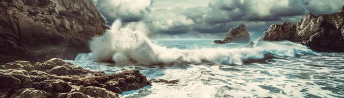 A large wave is crashing into a rocky shore photo