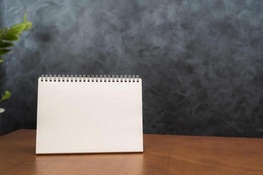 White paper sheet tent card on wooden table white isolated background can insert customer message. Stand mockup frame menu card tent blur key background photo