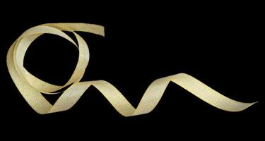 Golden ribbon isolated on black background and texture, with clipping path photo