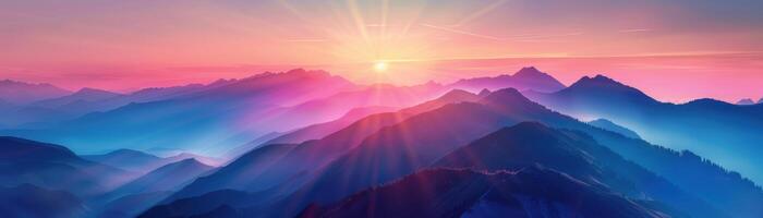 A mountain range with a pink and purple sky in the background photo
