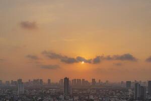 PM 2.5 dust in Bangkok,Capital city are covered by heavy smog,Sunset in downtown with bad air pollution, the Place to risk of cancer photo