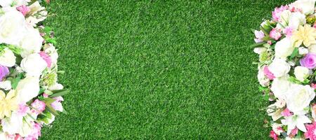 Beautiful wall from various artificial creeper plant for background. Combination of plants, artificial grass. photo
