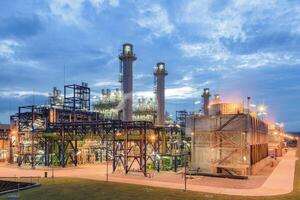 Cooling tower, gas fired power plant or gas fired power station. Factory, system and technology to burn natural gas to generate electricity, electrical energy. photo