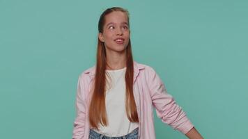 Funny girl making playful silly facial expressions and grimacing, fooling around, showing tongue video