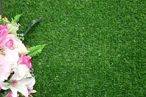 Beautiful wall from various artificial creeper plant for background.staircase green artificial grass with pink flower. photo