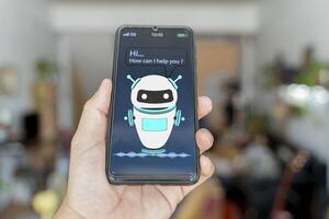 Customer and chatbot dialog on smartphone screen. AI. Artificial intelligence and service automation technology concept. photo
