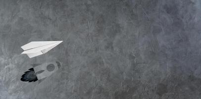 Start-up Company and Motivation in Business Concept. Paper Planes Flying with Shadow of Rocket photo