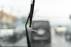Car wipers clean windshields when driving in sunny weather. photo